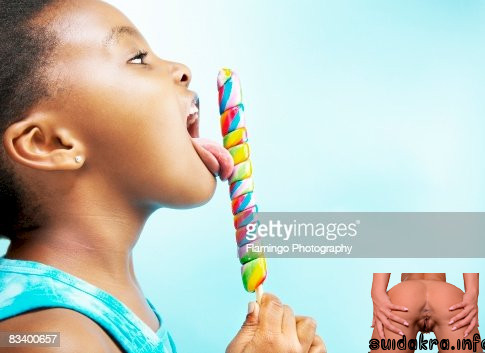 young side girl licking pics getty rf gettyimages lollipop