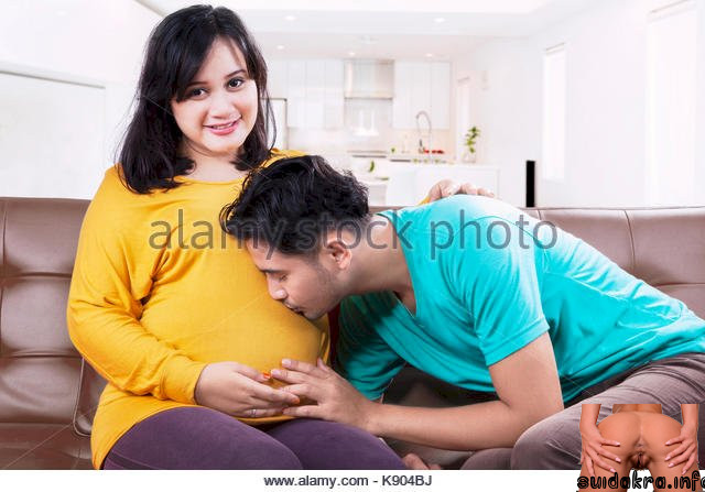 sitting tummy portrait husband proud hispanic pregnant wife kisses