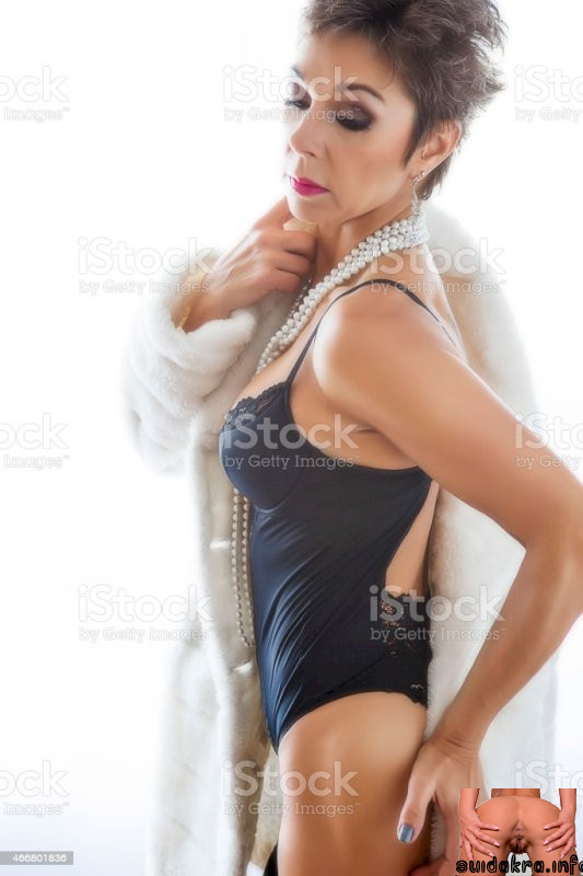 istock mature women in silk corset woman posing